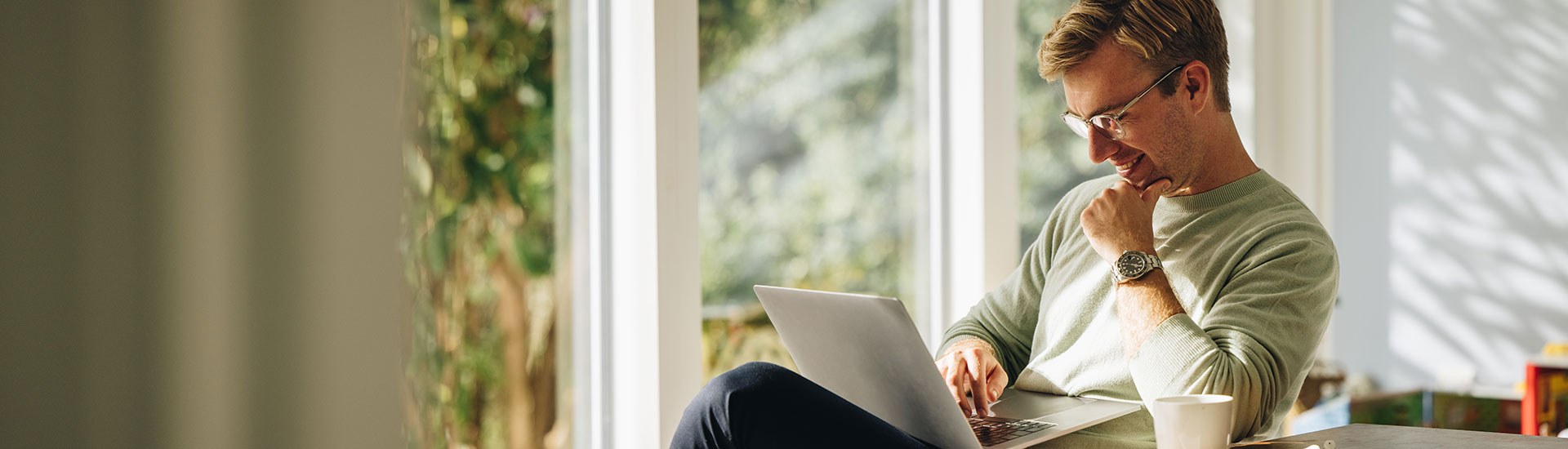 Understanding the Process of Debt Relief by Credit Vision A Man is Smiling and using Laptop